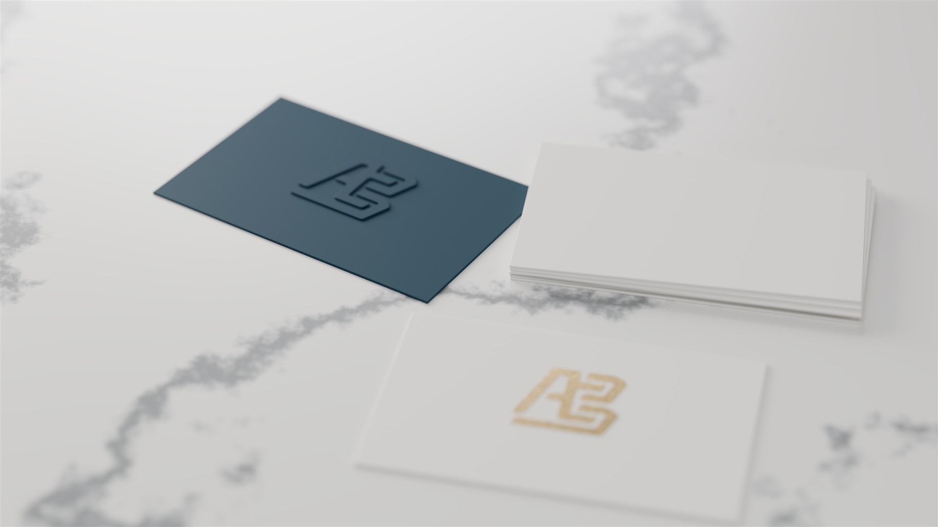 Tarjetas personales con el logo de AB Dev en relieve azul y dorado sobre mármol